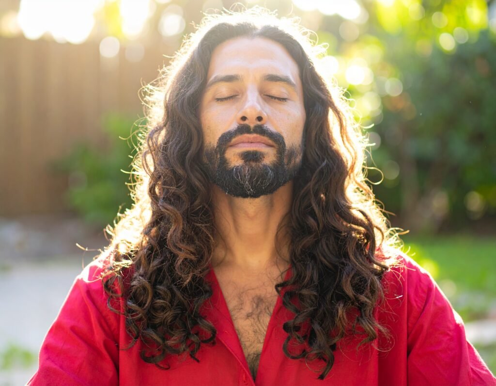 Man with long hair, focussing, harnessing the energy 
