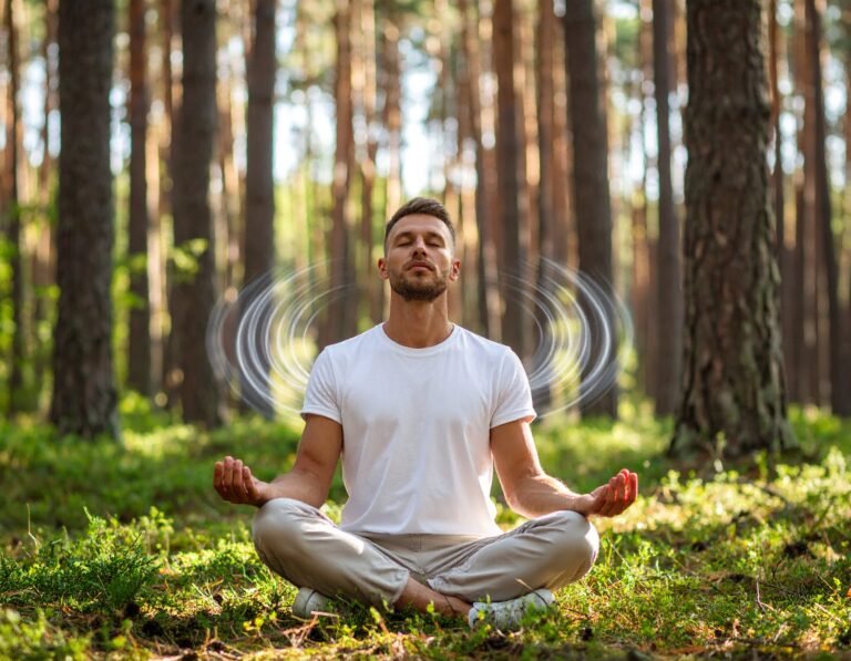 Man meditating in the woods