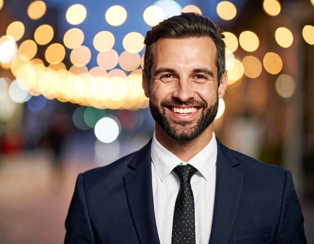 Man smiling in a suit 